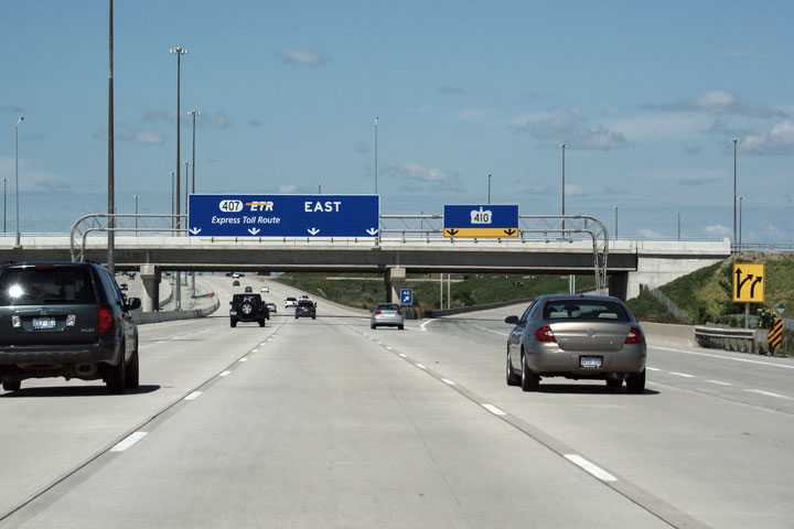 View from the 407ETR highway. We are traveling eastbound and can see other cars and highway signs